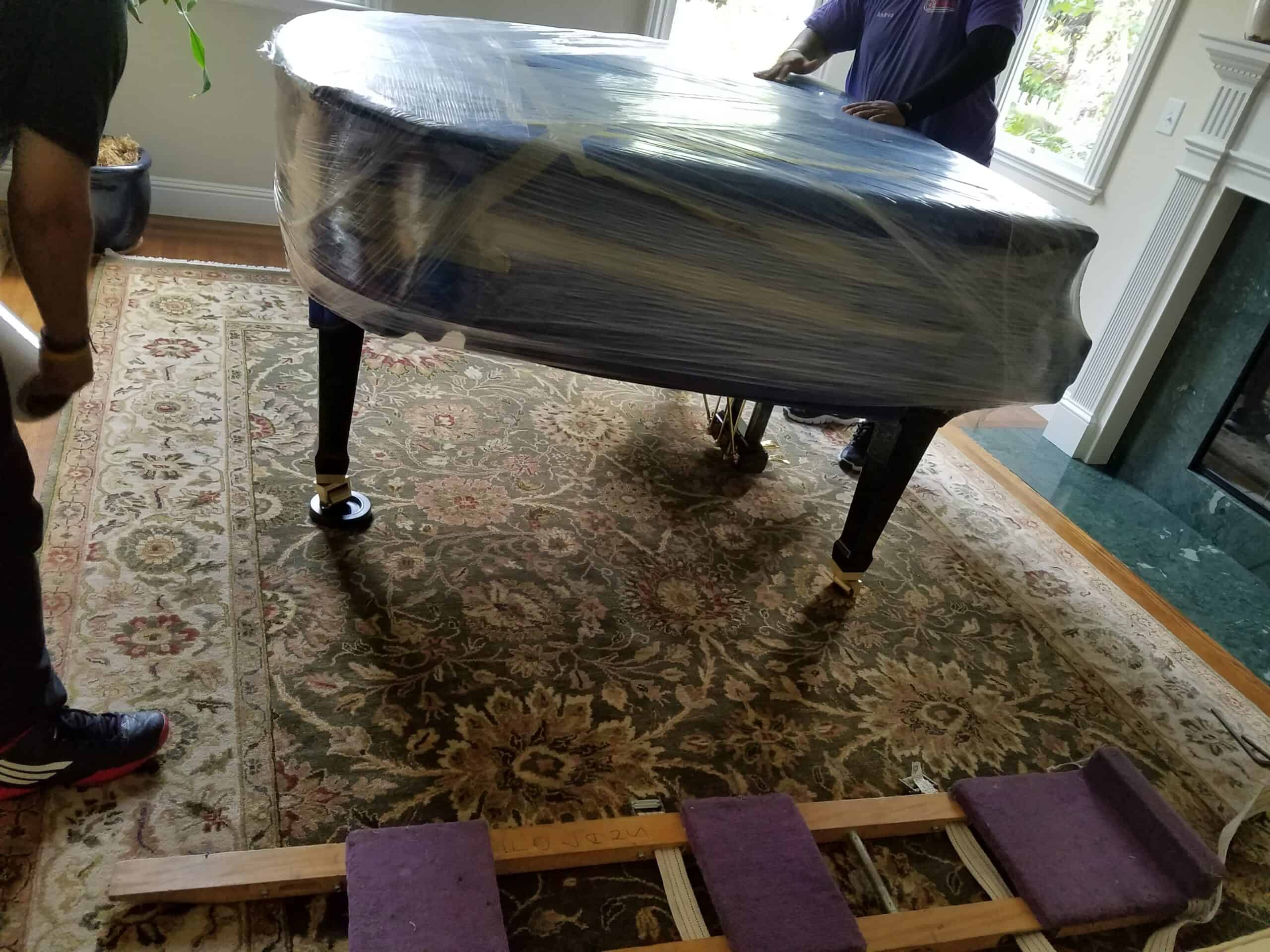 Loading piano into moving truck