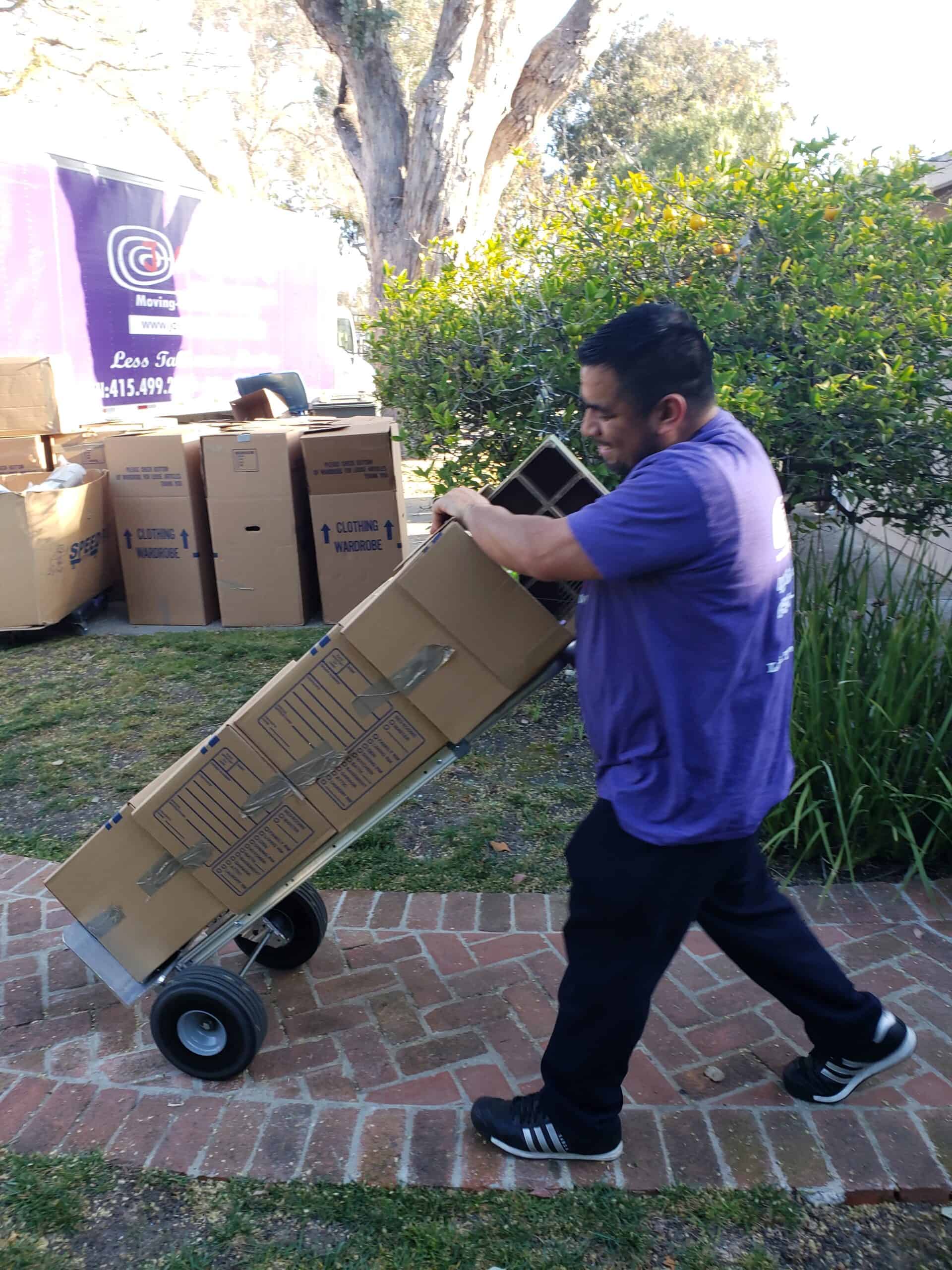 Movers carrying items to truck