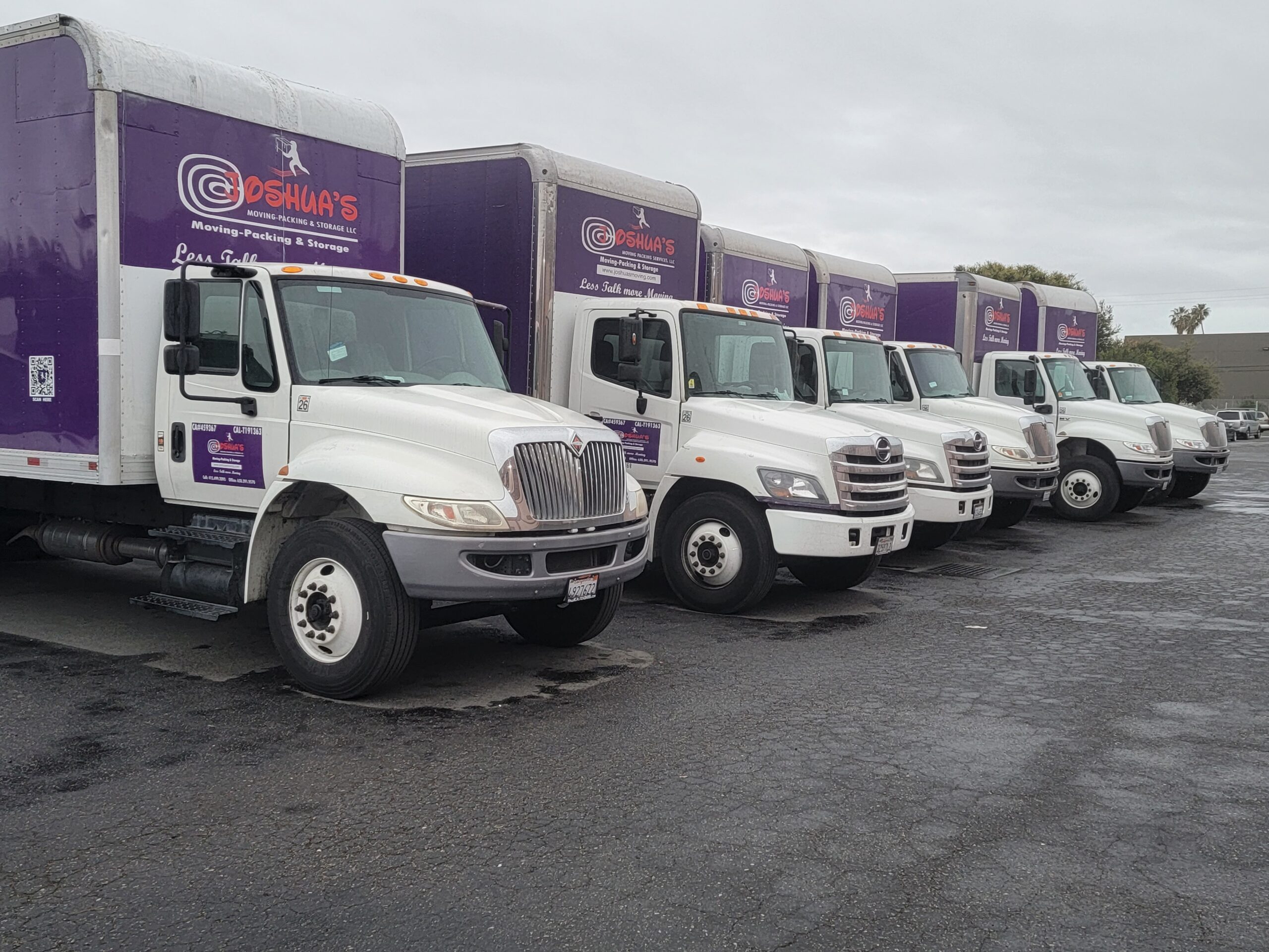 Apartment movers navigating furniture through hallway