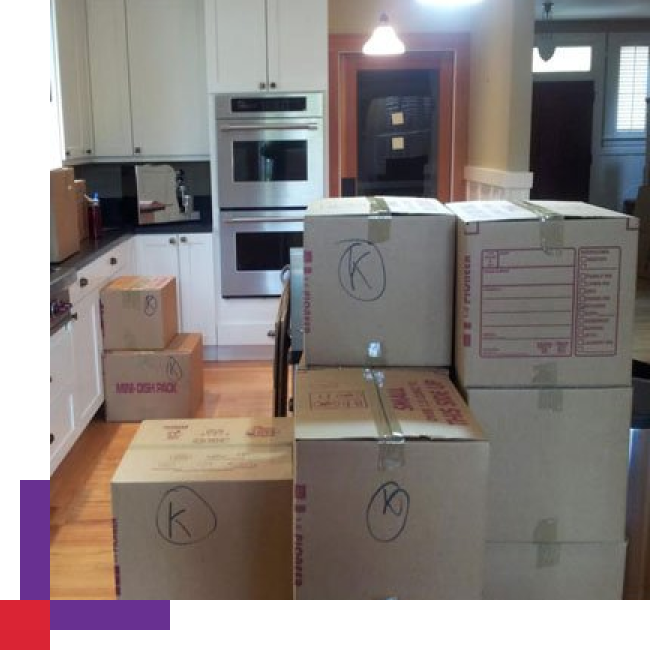 Professional packers carefully packing boxes for a move