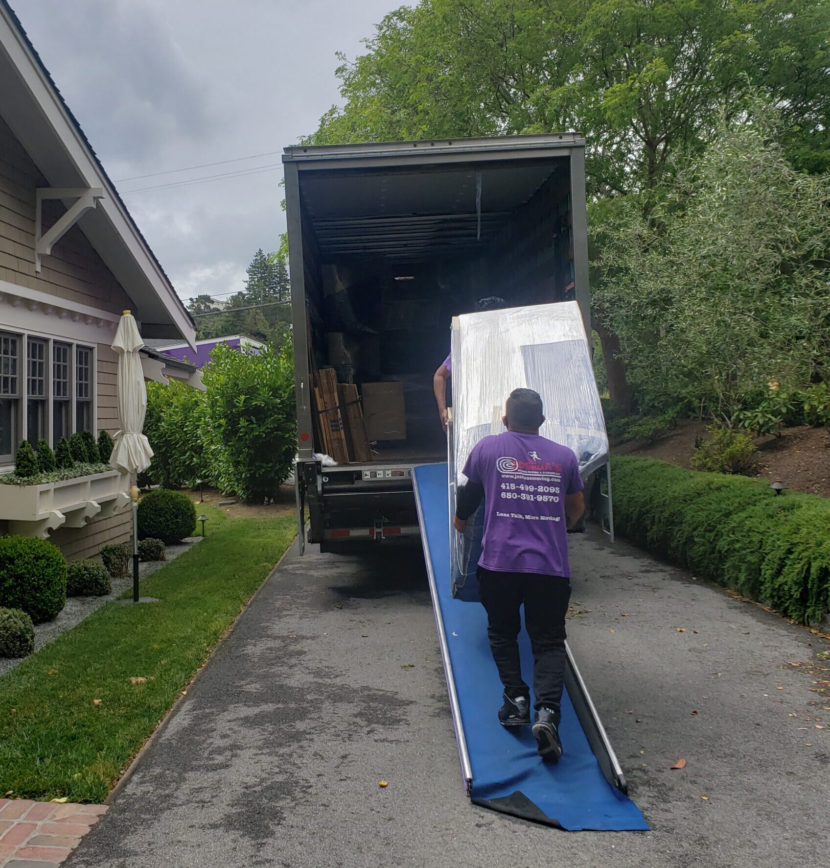 Residential moving team loading a truck